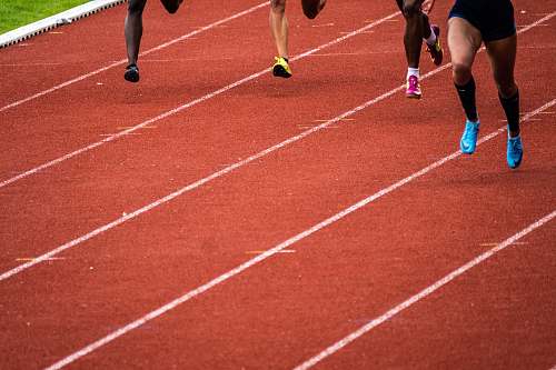 running track people running on race track sports